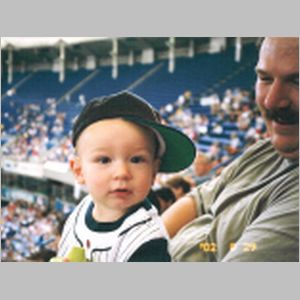 Danny and dad at the Twins game.jpg